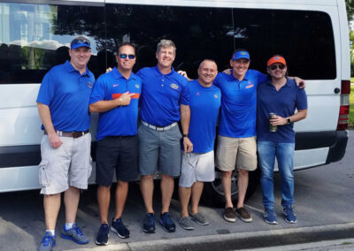 Gator fans in front of bus