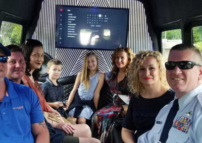 Group going to military ceremony in party bus