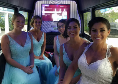 Bride and bridesmaids on bus