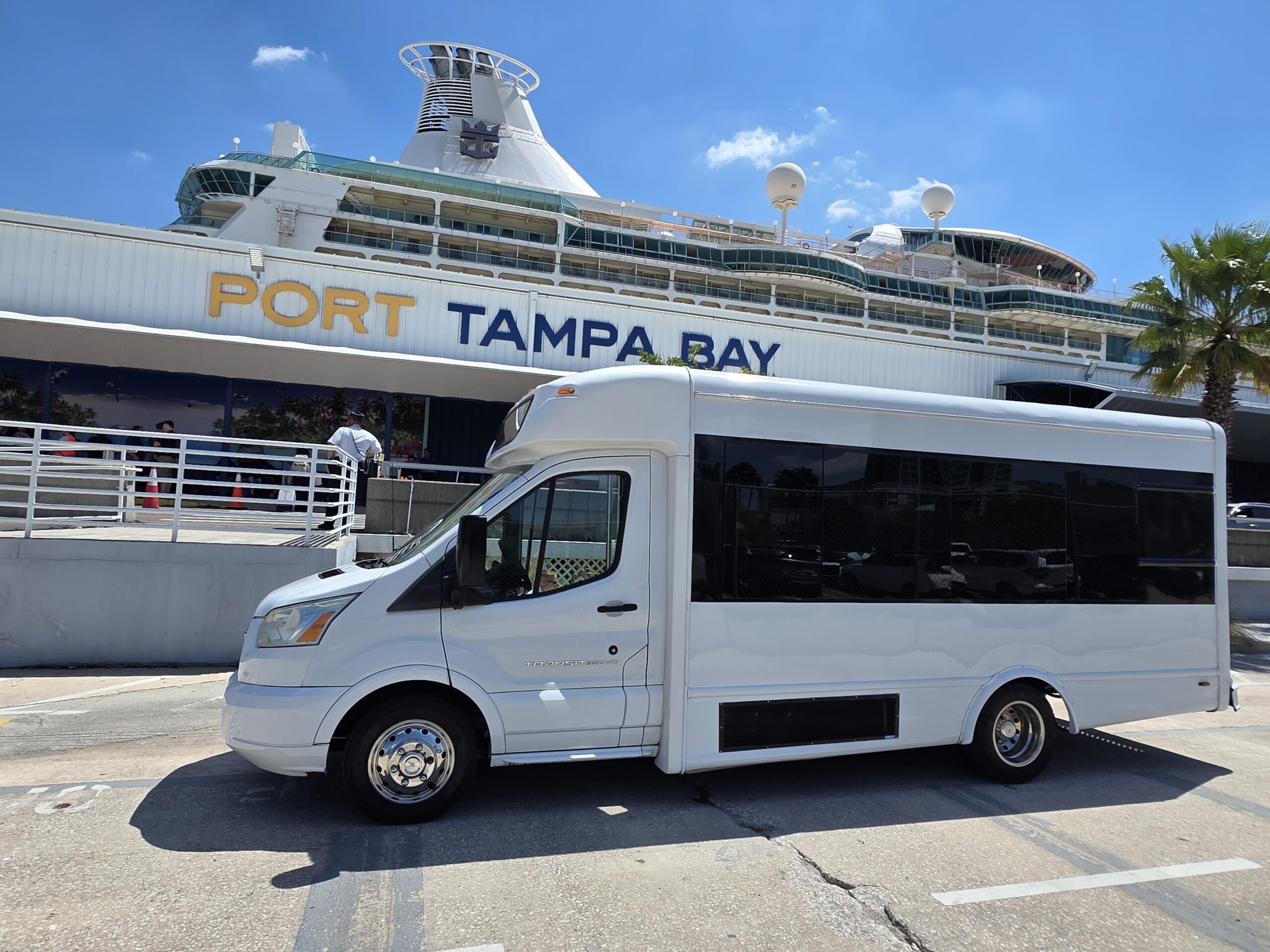 Luxury Elite Party Bus and Limo providing cruise port transportation to Port Tampa Bay with professional chauffeur and spacious interior for groups and luggage.